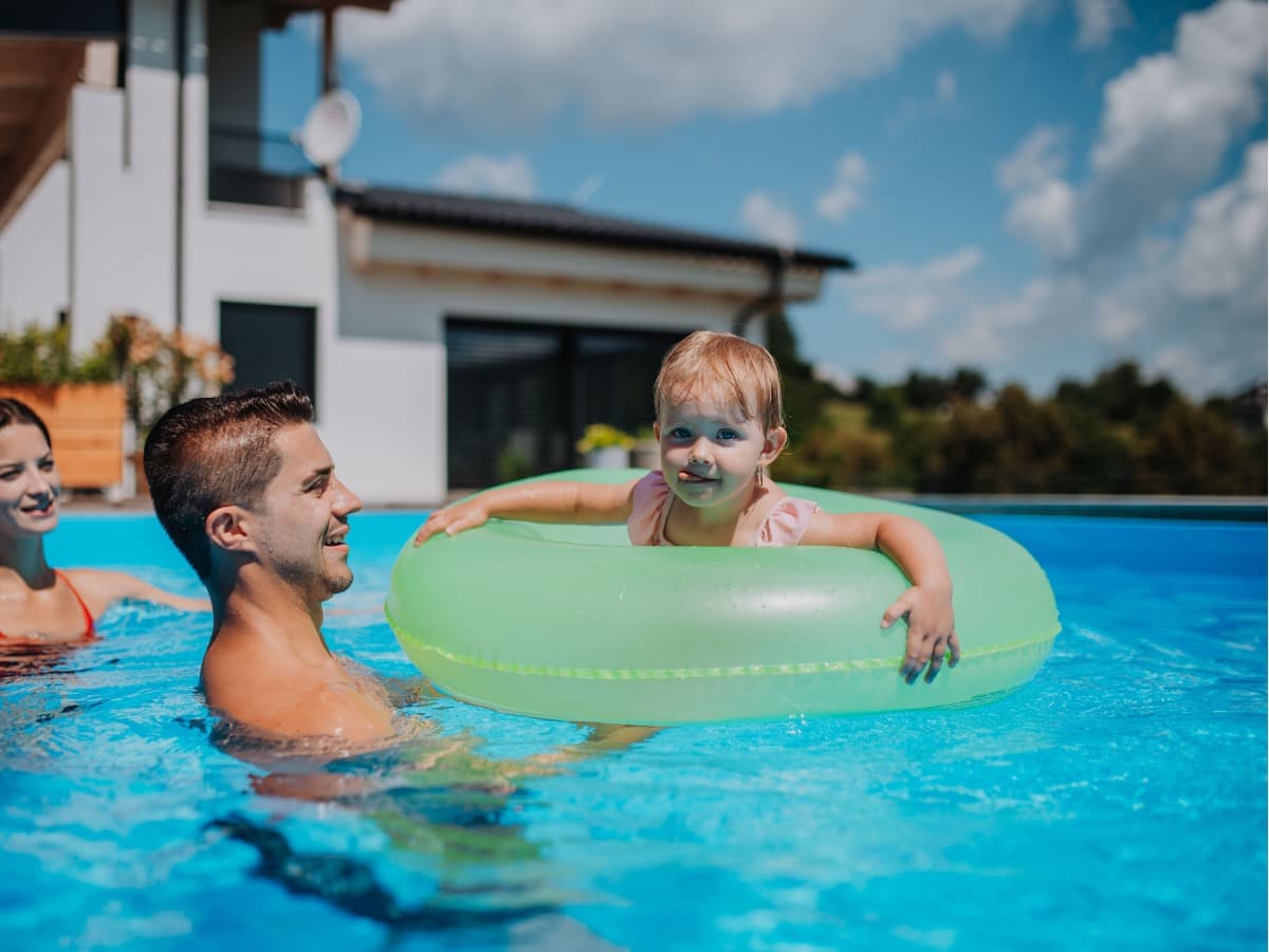 Family enjoying a clean backyard pool